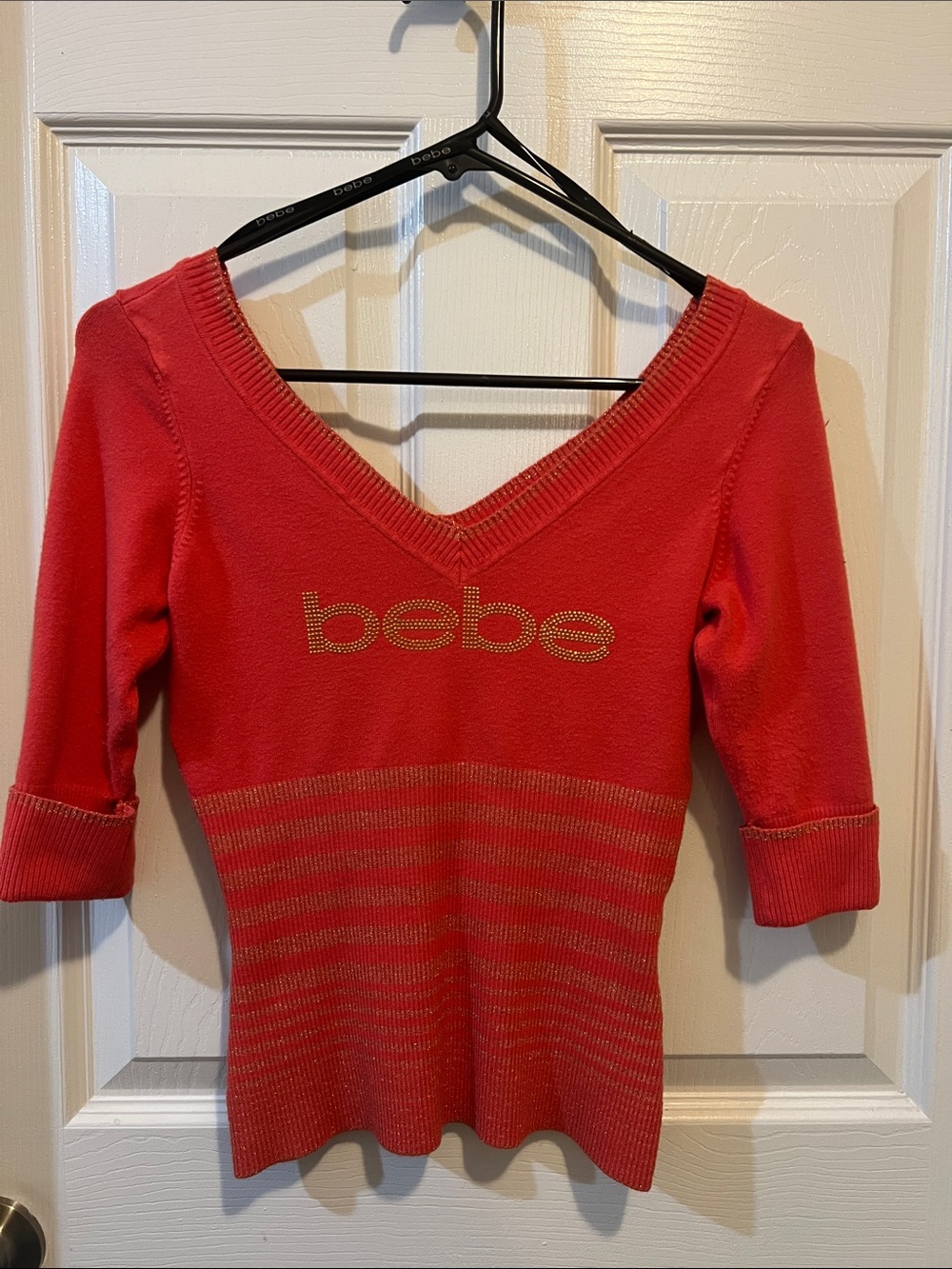 bebe Coral-Red V-Neck Knit Top with Gold Logo